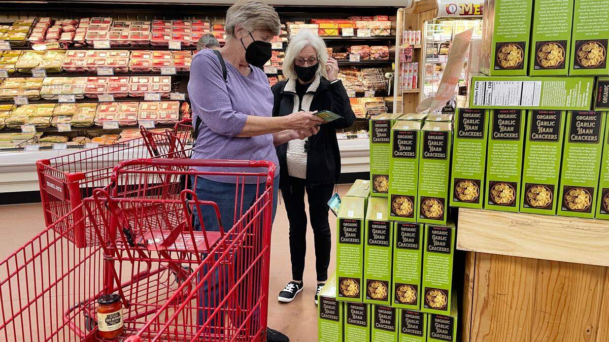 Sheila Rudesill, left, and Linda Dolittle live in Myrtle Beach but shopped at Trader Joe’s in Wilmington, N.C. on Feb. 10, 2022 as part of Senior Adventures in Learning and Travel.