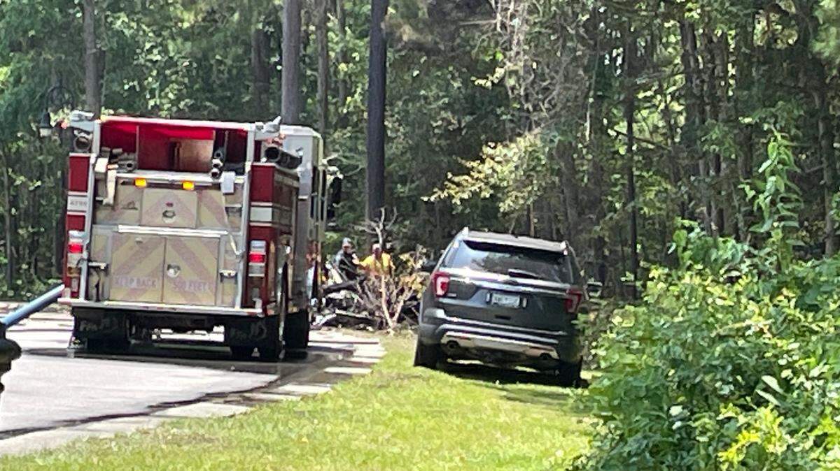 North Myrtle Beach crews responded to a single engine plane crash in the area of Barefoot Landing on July 2, 2023. The plane’s wreckage can be seen near rescue vehicles.