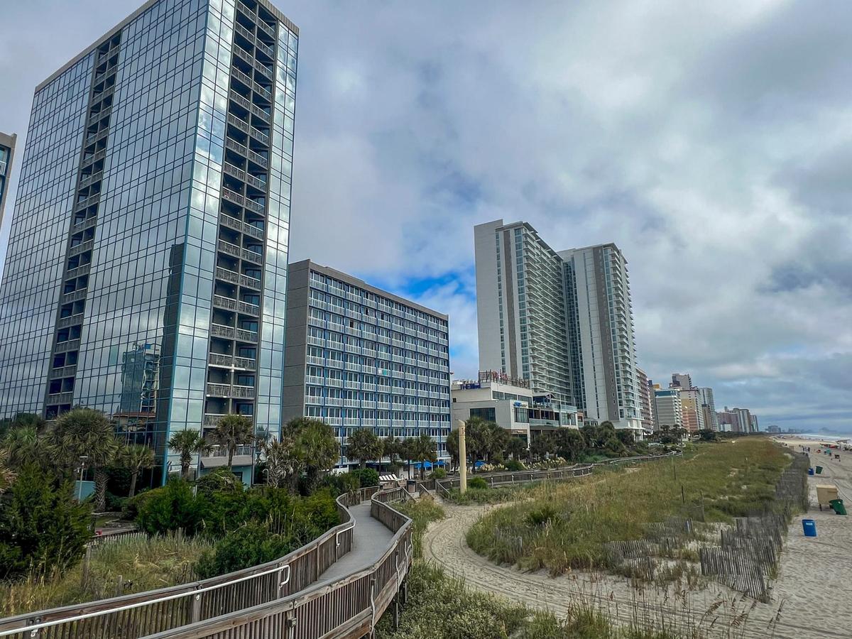 The Yachtsman Resort, left, is distinctive for it’s glass towers on the Myrtle Beach ocean front. In 2024 the City of Myrtle Beach halted converting short-term rentals and hotels near the ocean into long-term rentals Sept. 13, 2024. Sept. 13, 2024.