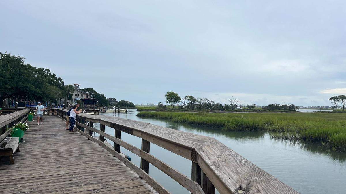 People enjoy the view at The Murrells Inlet MarshWalk. The popular restaurant area will open Thursday, Aug. 31 at 4 p.m.