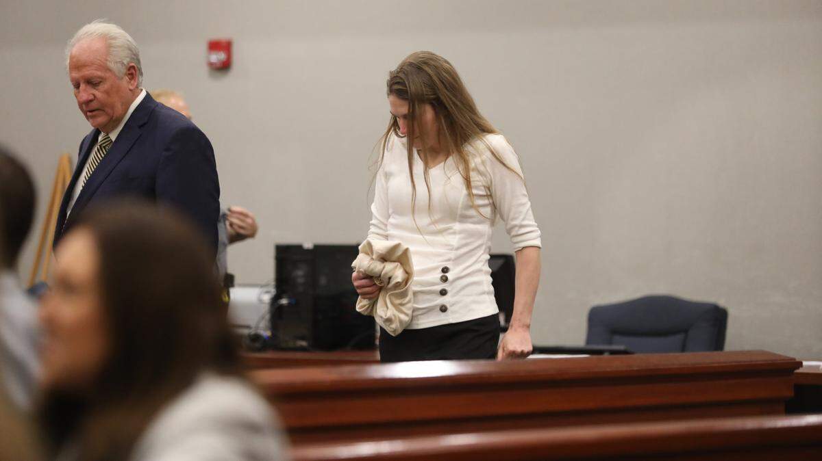 Meagan Jackson walks back to the defense desk during her murder trial. She has been accused of shooting and killing her ex-boyfriend Greg Rice, with assistance from a former Horry County Coroner.
