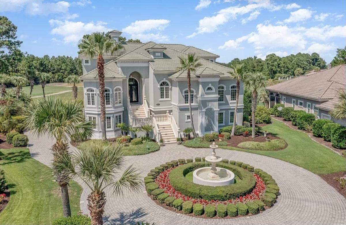A Mediterranean home is listed for $2.6 million on Zillow. The house, which is in the gated Grand Dunes community, has a large deck and a summer kitchen.