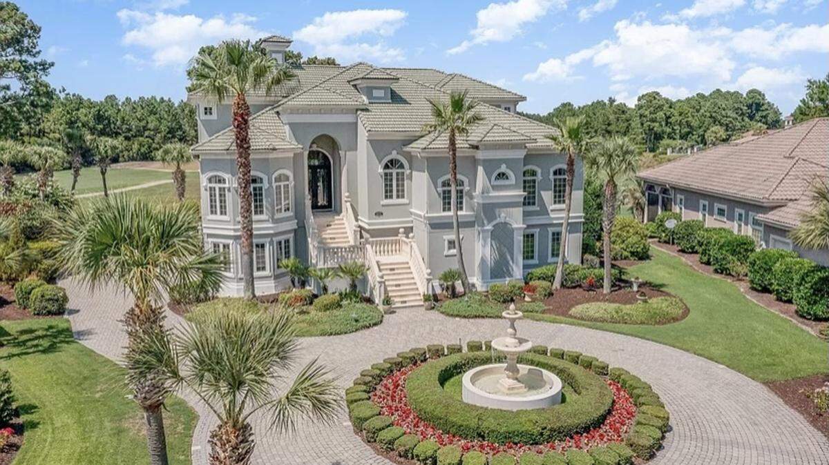 A Mediterranean home is listed for $2.6 million on Zillow. The house, which is in the gated Grand Dunes community, has a large deck and a summer kitchen.