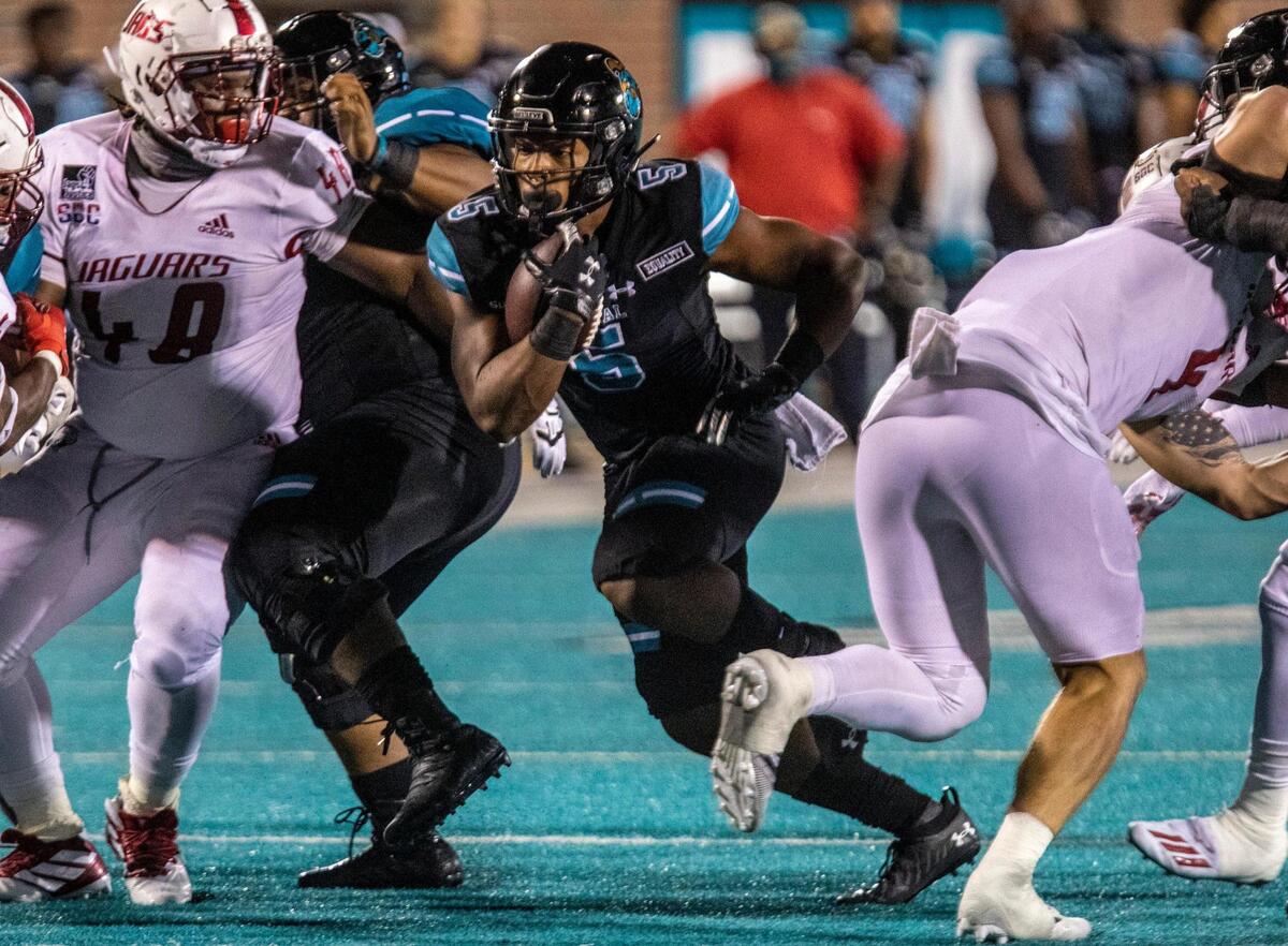 Coastal’s Shermari Jones (5) breaks through the South Alabama line on Saturday at Brooks Stadium in Conway. November 8, 2020.
