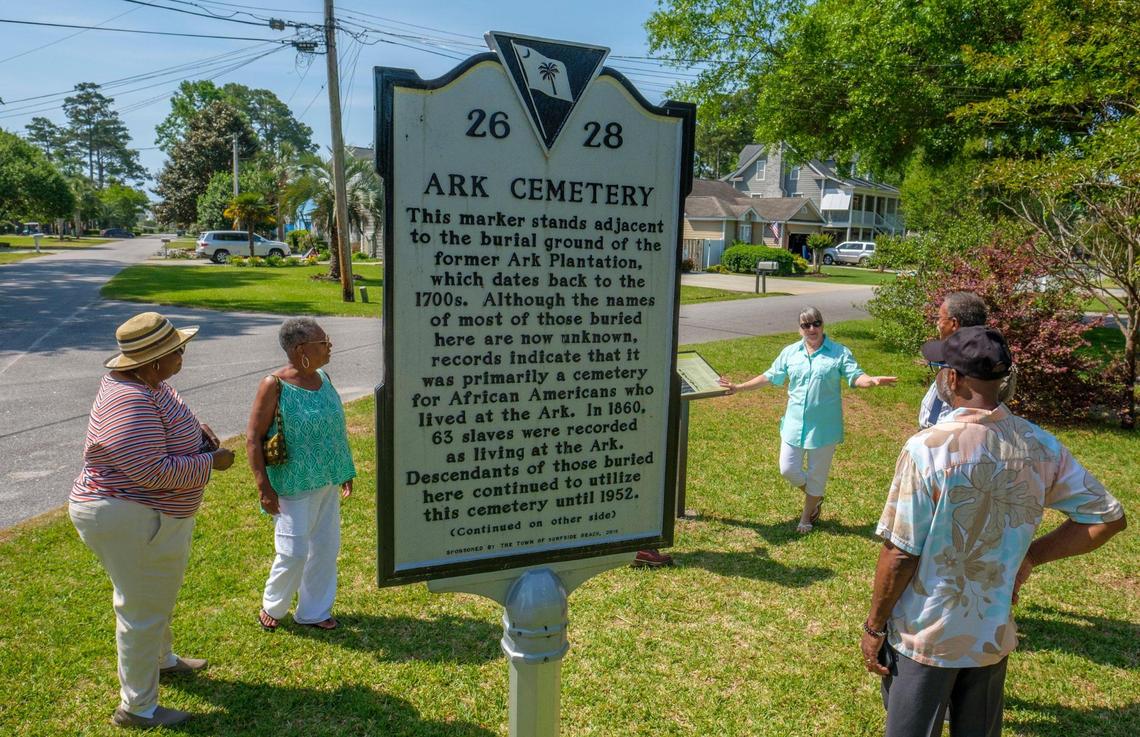 Joyce Suliman of the Surfside Beach Historical Society explains the significance of the Ark Cemetery to visitors of the site this morning. The Town of Surfside Beach, with assistance from the Surfside Beach Historical Society, unveiled historical plaques installed at the Ark Plantation site this morning that provide visitors to the site with information about the area’s history. May 03, 2022.