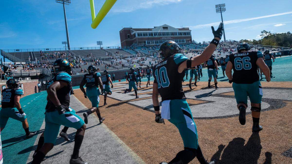Coastal Carolina players enter the field for their first game as a ranked FBS team against Georgia Southern last Saturday at Brooks Stadium in Conway. October 24, 2020.