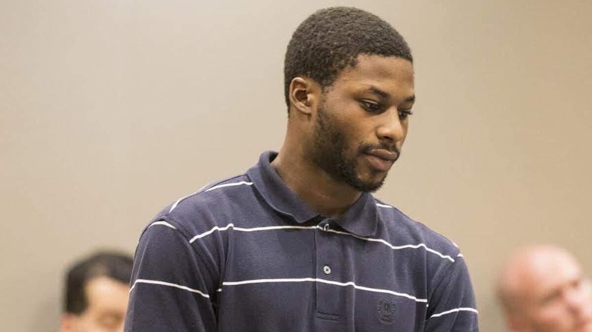 Micah Dennison leaves a courtroom on June 26, 2018 after pleading guilty to a robbery charge. His attorney said he also helped in the investigation into a double murder.