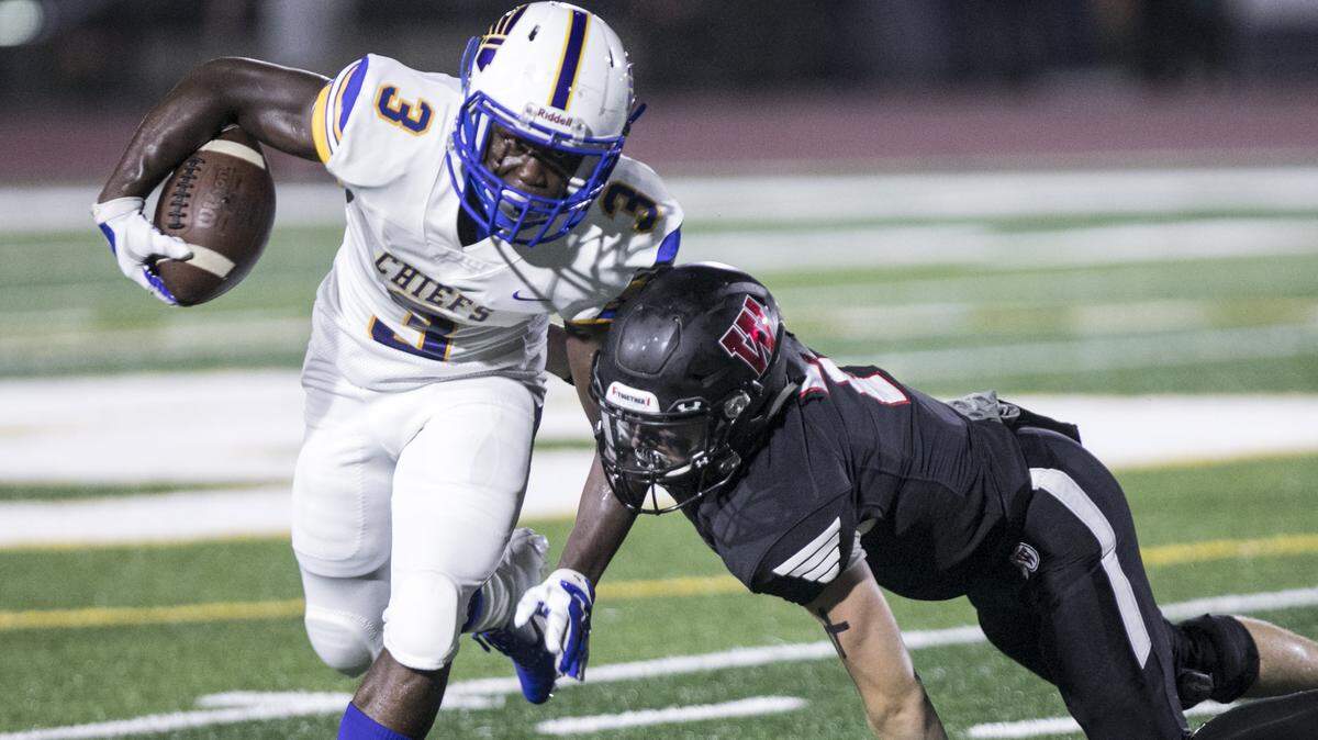 North Myrtle Beach’s Ramsey Lewis digs for yards against Waccamaw during the 2018 CNB Kickoff Classic on Friday at Doug Shaw Memorial Stadium. The Chiefs’ high-powered offense will face Conway’s stout defense Thursday in the opening game of the 2018 high school football season.