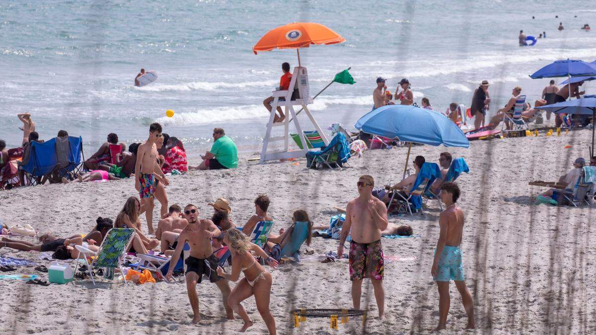 A summer haze blankets beach crowds in North Myrtle Beach, S.C. June 9, 2023.