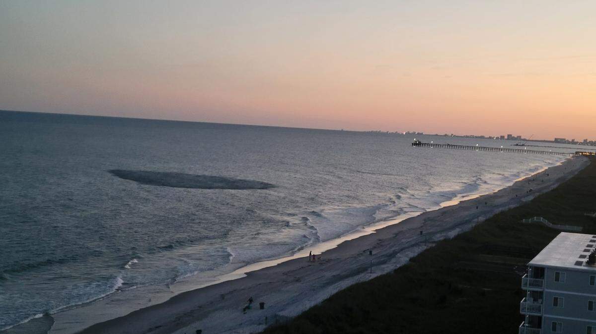 A black blob appeared off the coast of Cherry Grove. It’s most likely a giant school of fish.