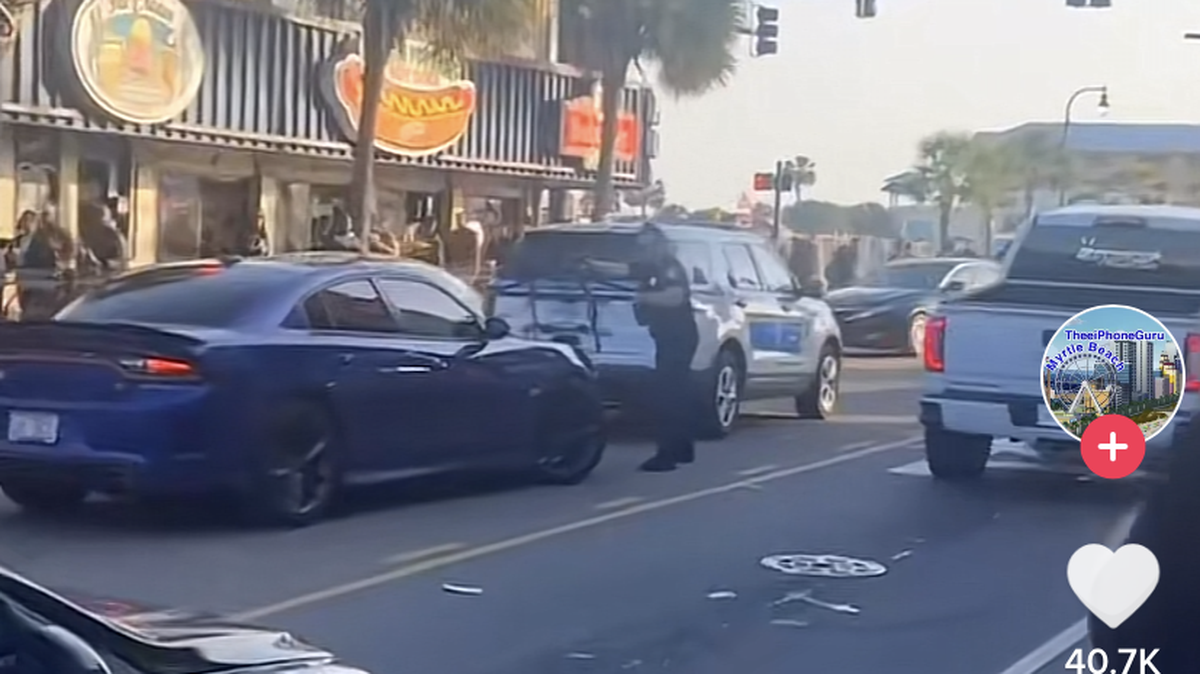 A viral Tiktok video shows several police officers pointing their weapons as they approach an occupied car on Myrtle Beach’s Ocean Boulevard.