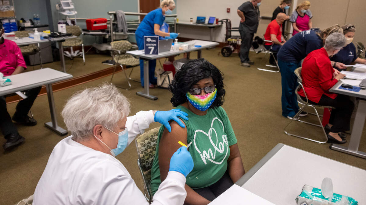 Regina Jenerette, a cafeteria manager at Myrtle Beach Elementary was among the first to get vaccines earmarked for Horry County Schools employees. Employees began getting their first doses of the Pfizer vaccine on Friday at a Conway Medical Center clinic. March 12, 2021.