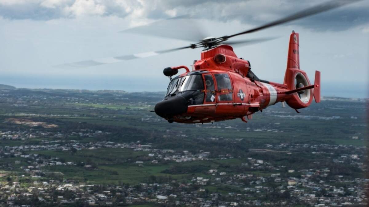 A Coast Guard helicopter crew rescued three fishermen after their boat sank off Myrtle Beach.
