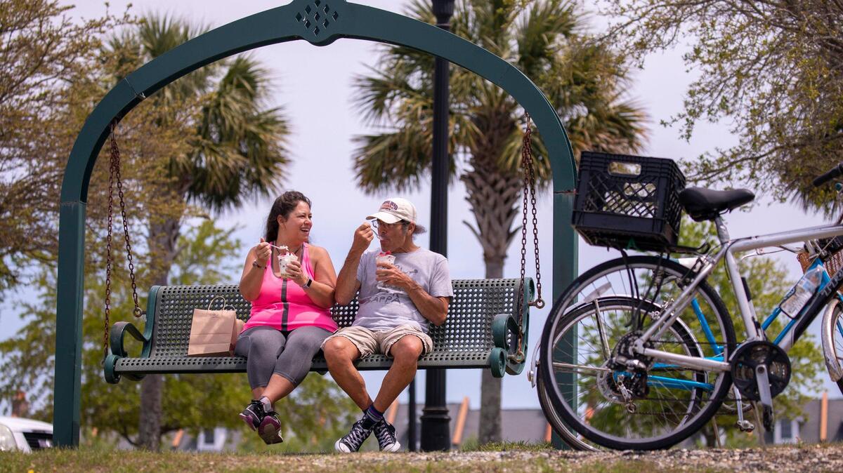 Helen and Will Francella enjoy ice cream after a bike ride around Market Common’s Grand Lake. Locals around the Grand Strand were enjoying the Spring weather on Tuesday by getting outside. South Carolina’s Governor Henry McMaster toughed his “work or stay home” order this week In response to the coronavirus, but he made allowances for recreational activities. April 7, 2020