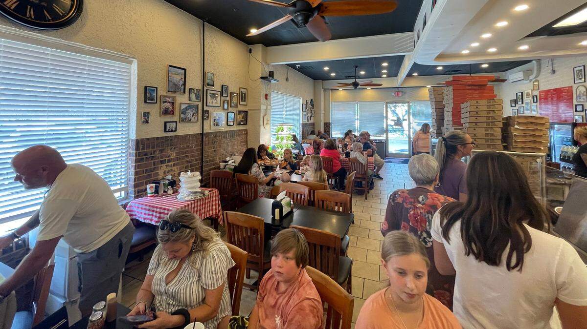 Patrons attend the soft opening of Anto’s Pizza Romana & Italian Market in downtown Conway, SC Oct. 14, 2024. The eatery is one of many new restaurants that have opened in Conway in recent years.