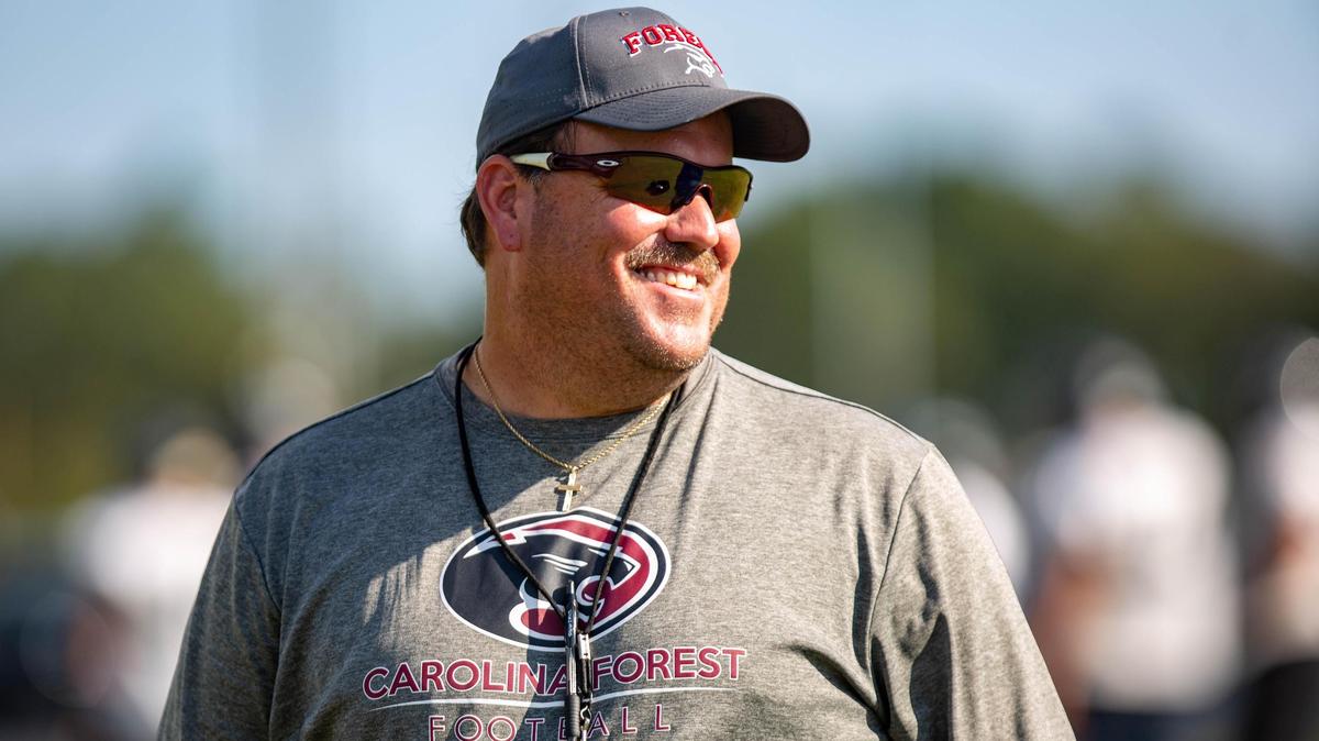 Carolina Forest head football coach Marc Morris watches as players run a drill during practice Thursday at Carolina Forest High School. The Panthers host South Florence at 7 p.m. Saturday for their first game in four weeks.