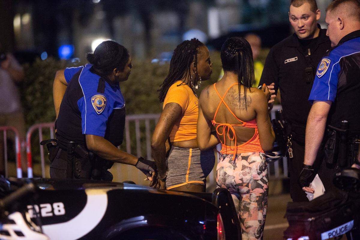 A woman is placed in handcuffs after police conduct a traffic stop on Ocean Boulevard in Myrtle Beach early Saturday morning, May 26, 2018. Some people who come down for the Atlantic Beach Bikefest claim that the heavy police presence and 23-mile loop are unfair and racist, citing comparisons to the fall motorcycle rally in Murrells Inlet and North Myrtle Beach that attracts a predominately white crowd.