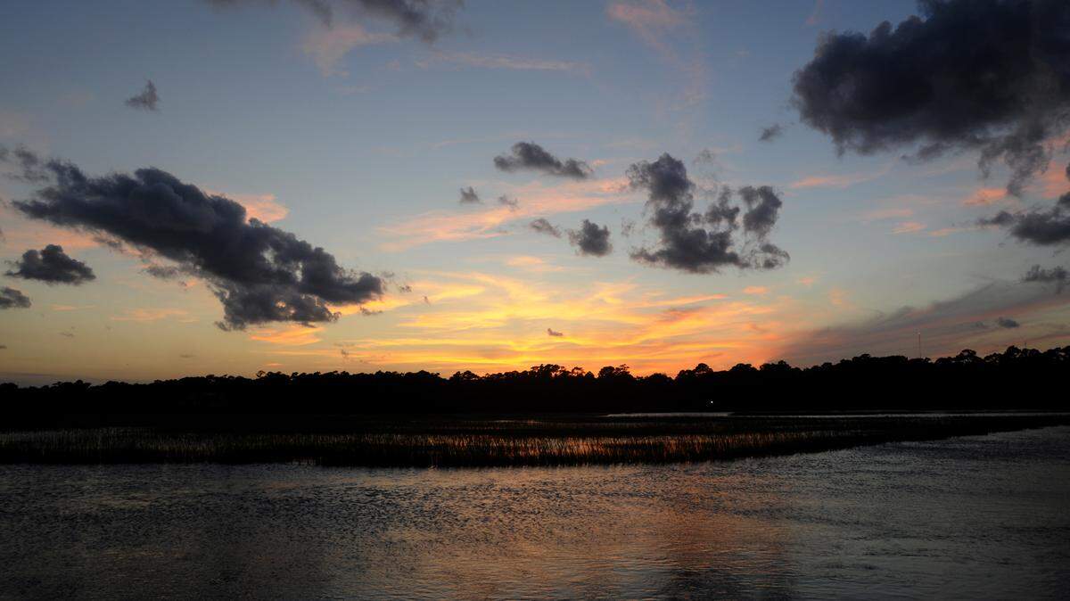 The beautiful sunsets over the marsh on Pawleys Island usually fill the creek docks with visitors and locals enjoying the end of the day. -
