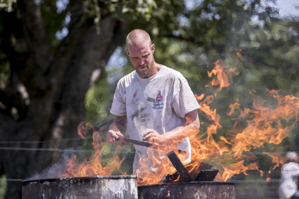 Ian Malcolm stokes a fire as he does chores around the Recovery Ranch and says that finding a purpose and helping others is the reason he stays sober. Aug 23, 2018.