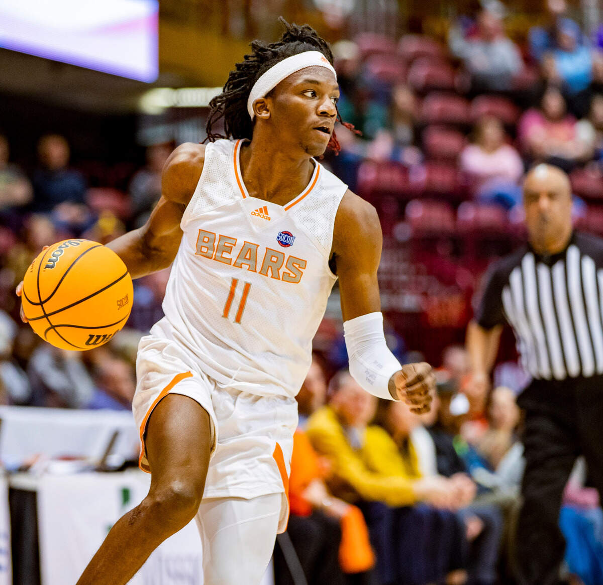 Mercer sophomore guard Jovan Tucker drives to the net against West Carolina junior forward Marlow Gilmore Friday night during the SoCOn Ingle Basketball Championships at the Harrah’s Cherokee Center in Asheville, N.C.