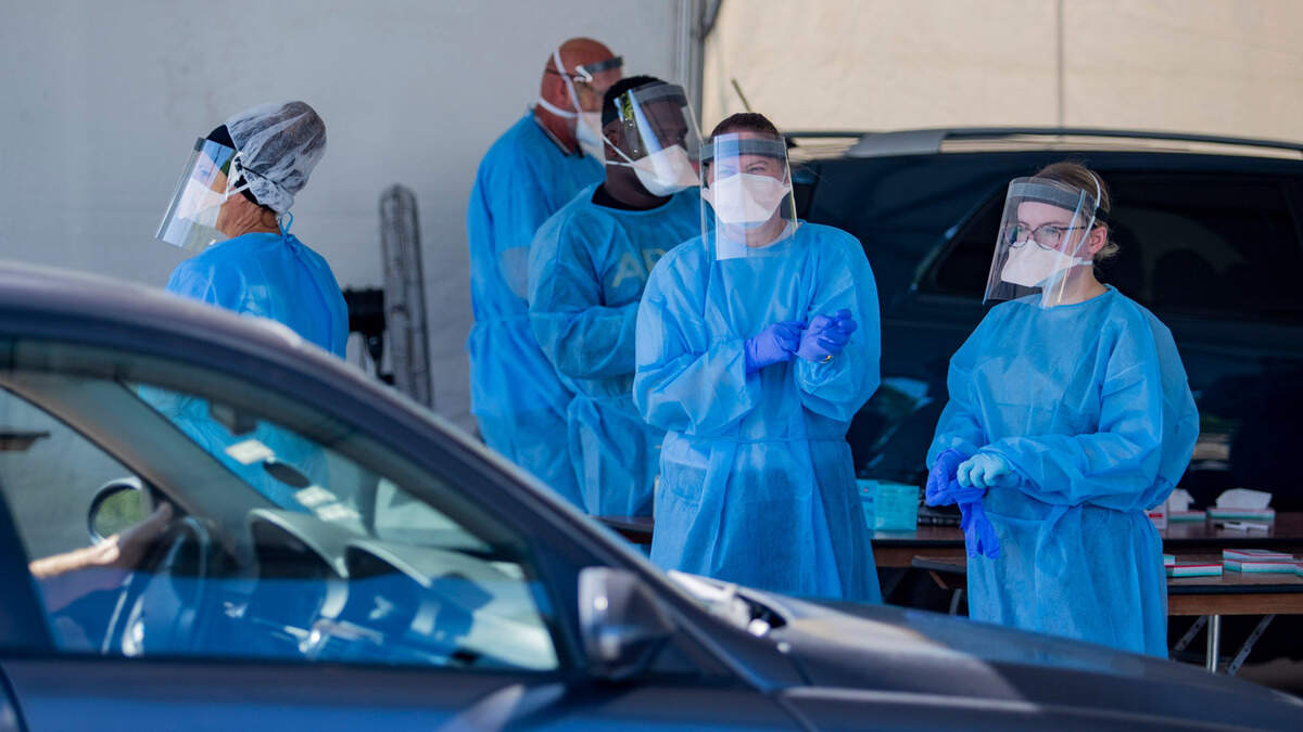 In this July 2020 file photo, Tidelands Health medical professionals operate a drive-through COVID-19 testing site in at Myrtle Beach Pelicans Ballpark.