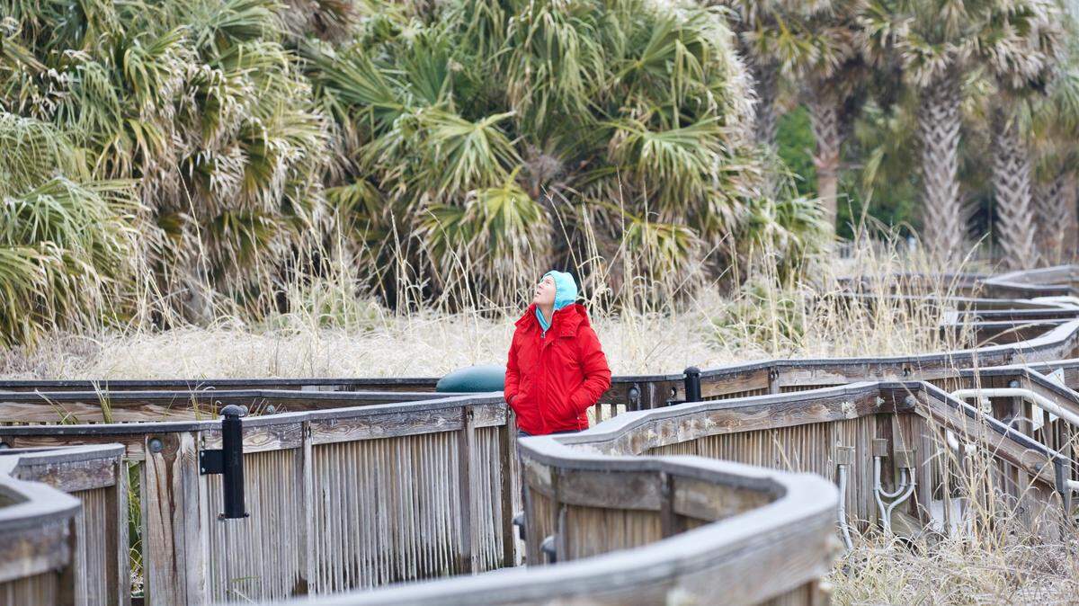 A man is taking a morning stroll on the Myrtle Beach Boardwalk after the ice storm on Saturday, Jan. 22, 2022.