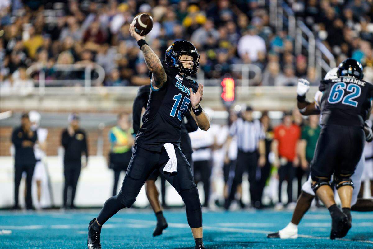 Coastal’s Ethan Vasko sets to pass against App State. The Coastal Carolina Chanticleers beat the Appalachian State Mountaineers 38-24 in front of the second-biggest Brooks Stadium crowd of the season on Thursday night. November 7, 2024.