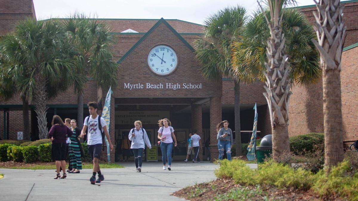 Myrtle Beach High School students head for the buses as the school day ends.