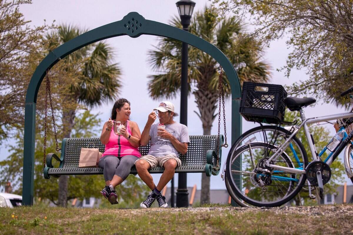 Helen and Will Francella enjoy ice cream after a bike ride around Market Common’s Grand Lake in 2020.