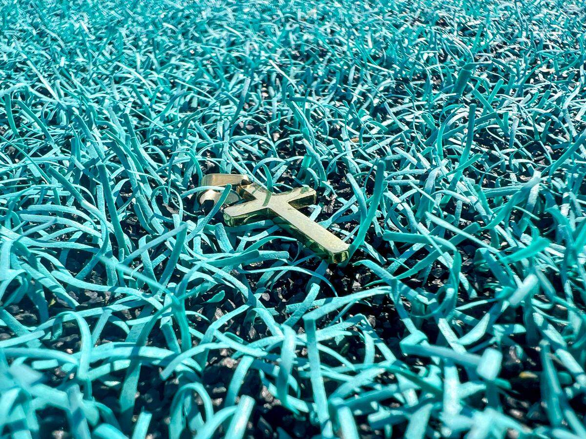 An earring found on Brooks Stadium’s teal field by a magnet machine used to clean the turf. Grinter said the magnet’s found several items before.