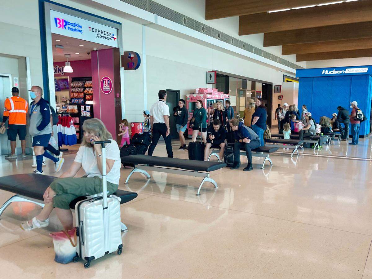Few travelers at Dallas Love Field in Texas wore masks during a recent visit on Saturday, April 23, 2022. A federal judge struck down the Transportation Security Administration’s mask mandate for airports and planes five days before.