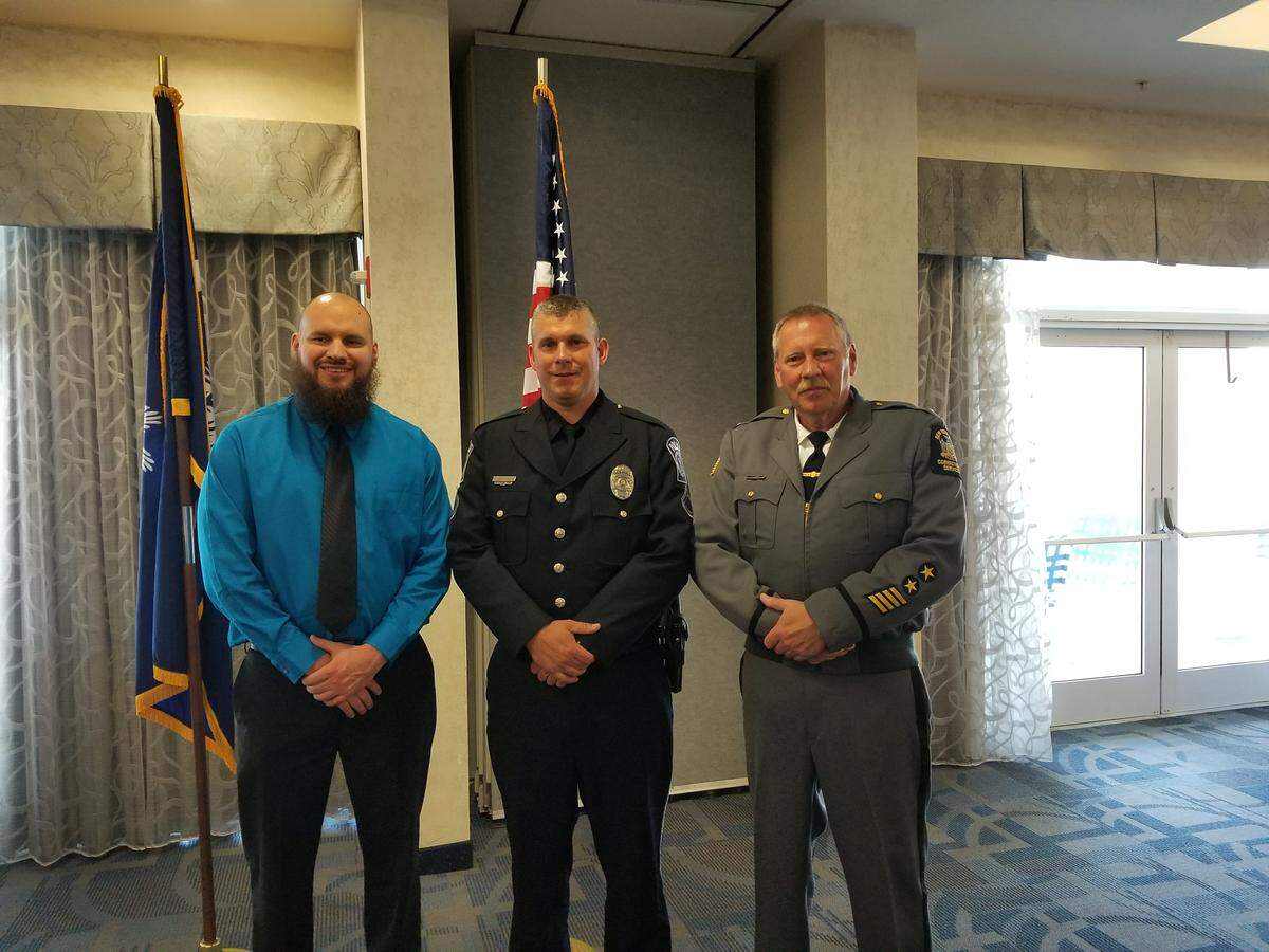 Shaun Skursky, left, a North Myrtle Beach police officer Donnie Constransitch and Tim Corey are recognized after they helped rescue a 12-year-old boy who was trapped underwater at the Avista resort in North Myrtle Beach on March 19, 2018.