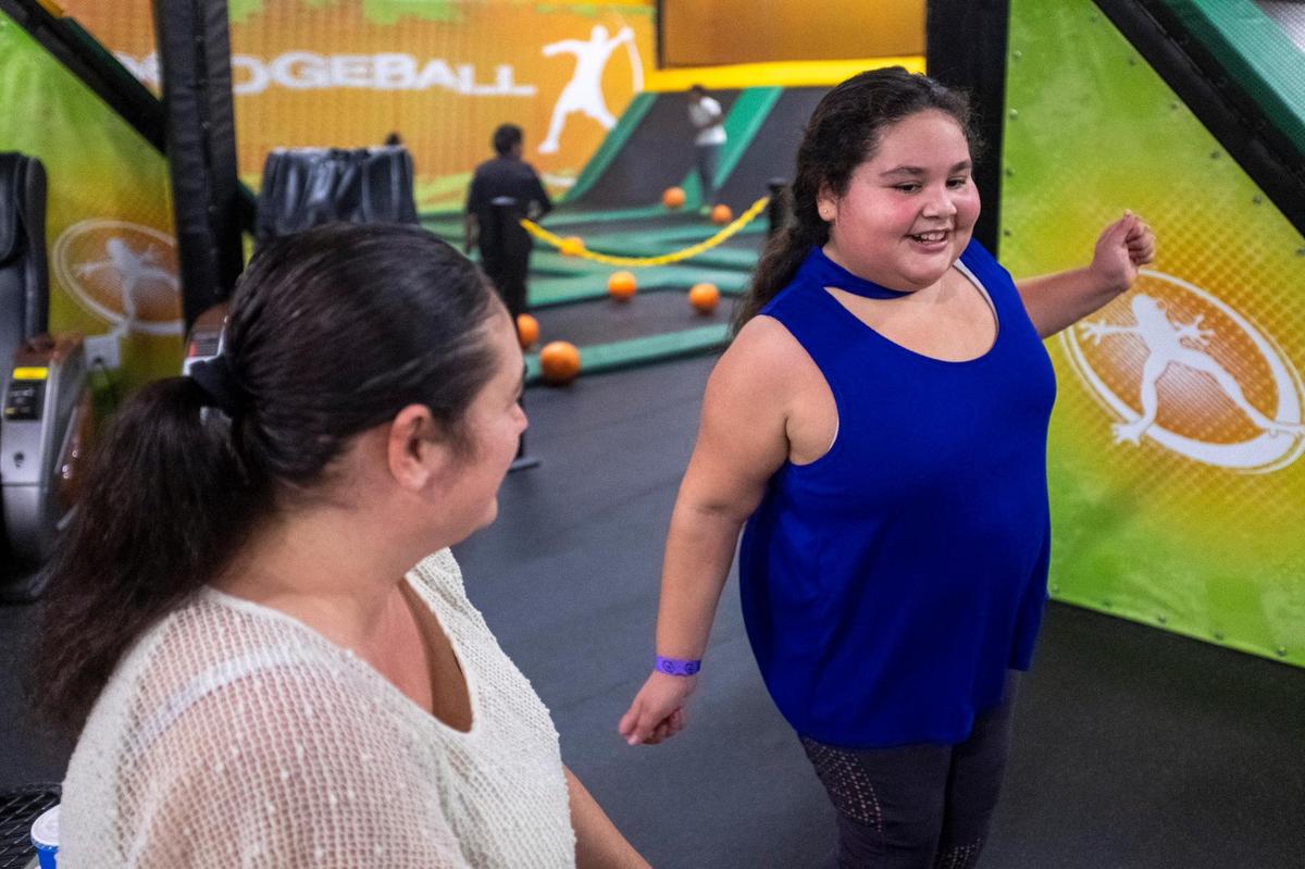 Faith Ruiz, 8, dances for her mother Vanessa during one of the family’s frequent visits to a trampoline park. January 25, 2021.