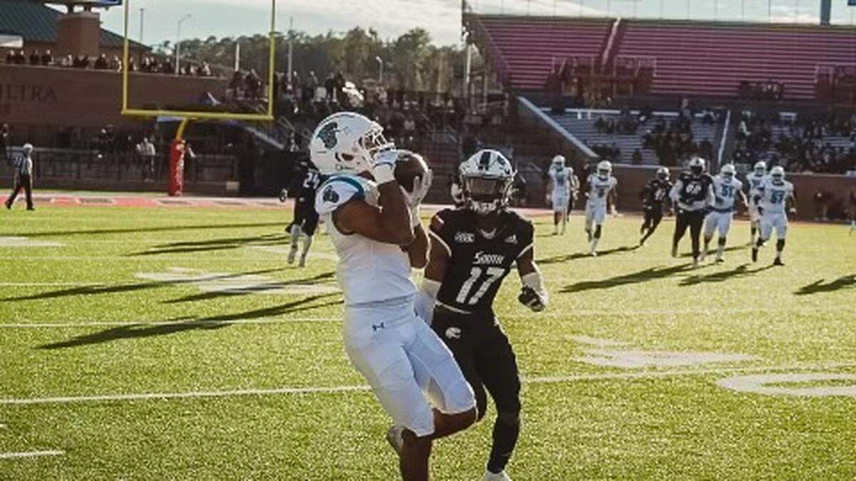 Coastal Carolina receiver Jaivon Heiligh catches a pass against the South Alabama defense on Friday at Hancock Whitney Stadium in Mobile, Ala. Nov. 26, 2021