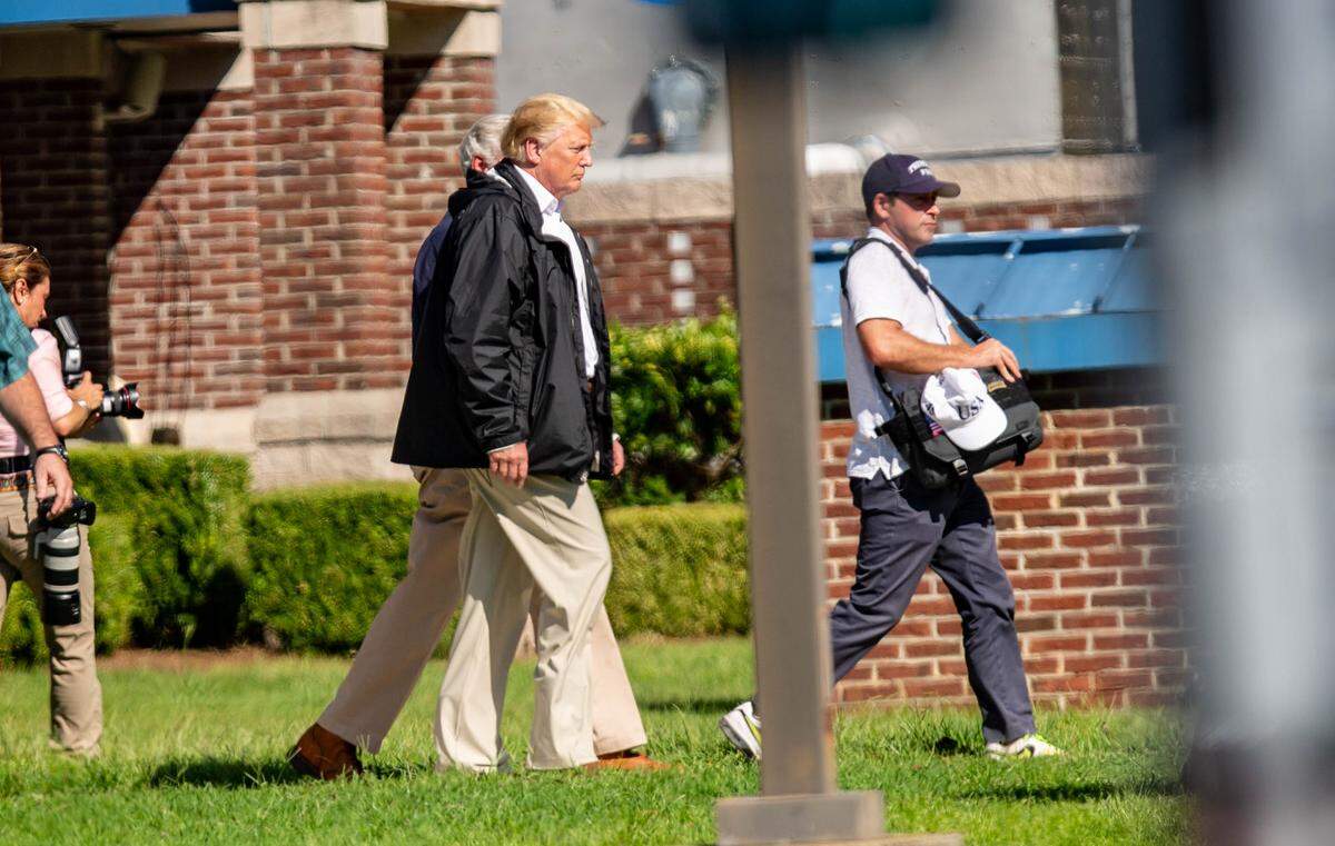 President Donald Trump exits the ML Brown building in Conway Wednesday. Trump was in the Carolinas for a briefing on the damage done by Hurricane Florence, and to meet with flood victims affected by the storm.