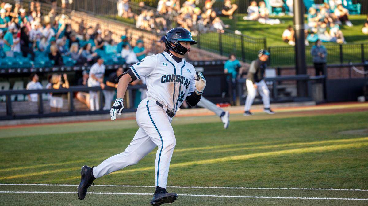 Coastal’s Tyler Johnson runs out a double in the 2022 season-opener against Kent State at Spring Brooks Stadium in Conway on February 18, 2022. Johnson had two home runs against Clemson on Tuesday.