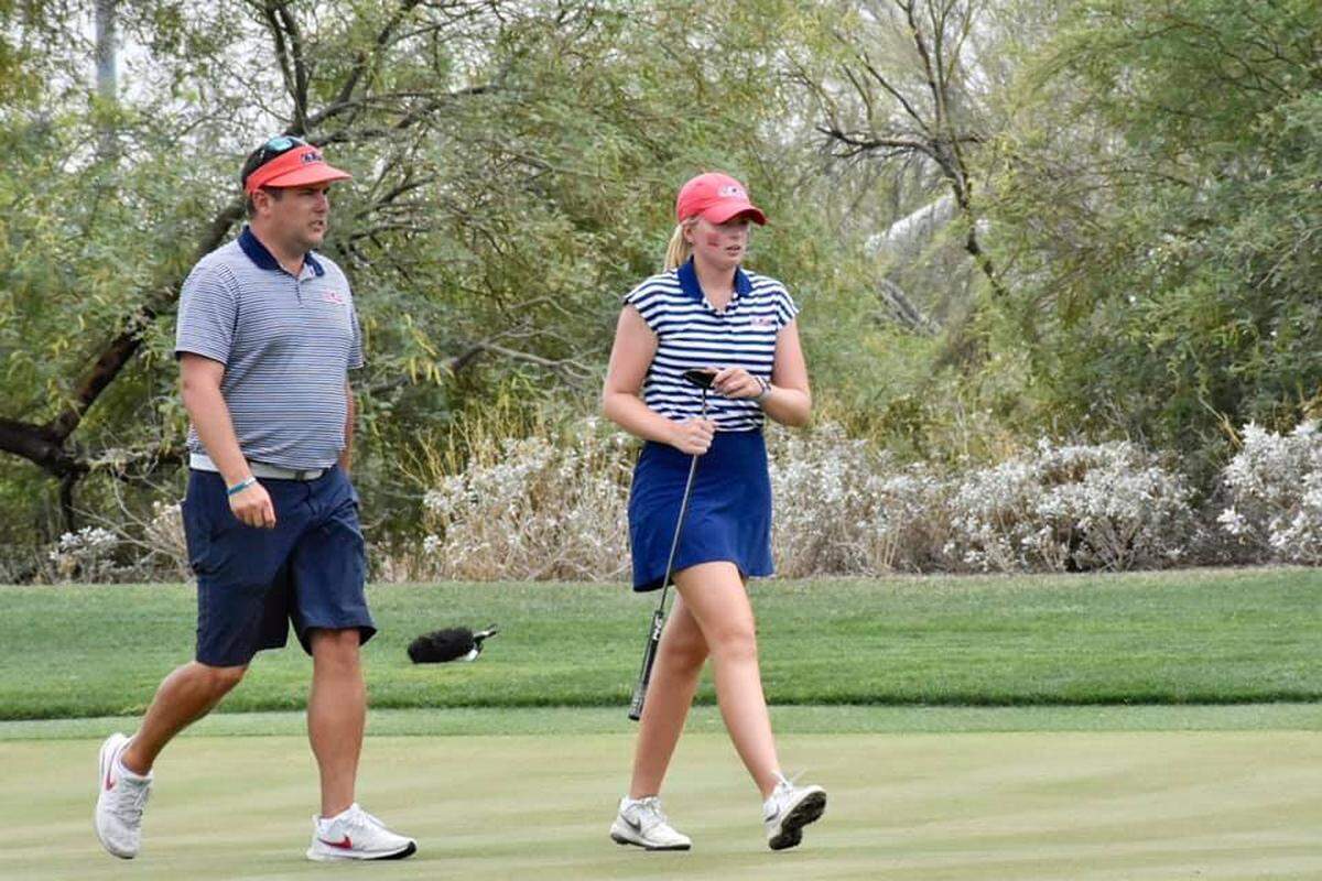 Ole Miss assistant coach Zack Byrd, a Coastal Carolina alumnus, walks with a player during the 2021 NCAA women’s golf championship at Grayhawk Golf Club in Scottsdale, Arizona.