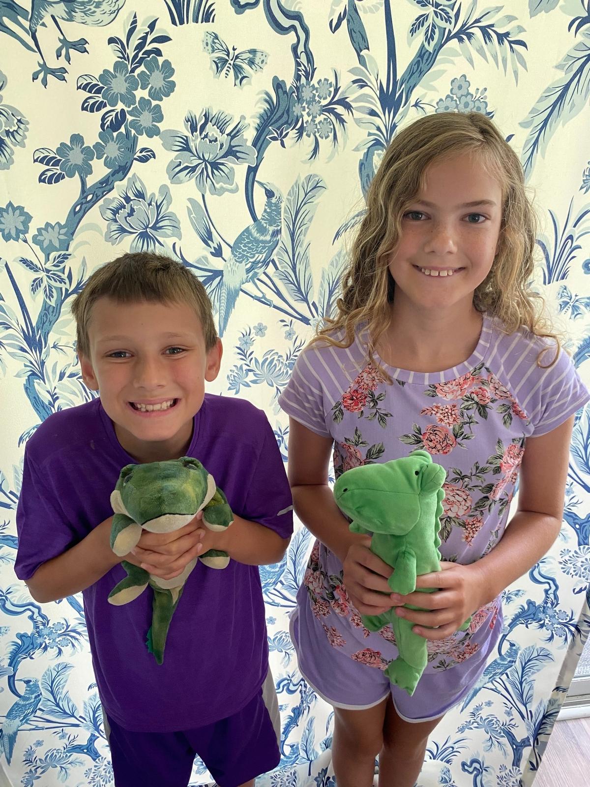 Timmy and Gabby Yauger holding their stuffed alligator toys. The children were excited to see an alligator in real life on Monday night at Huntington Beach State Park.