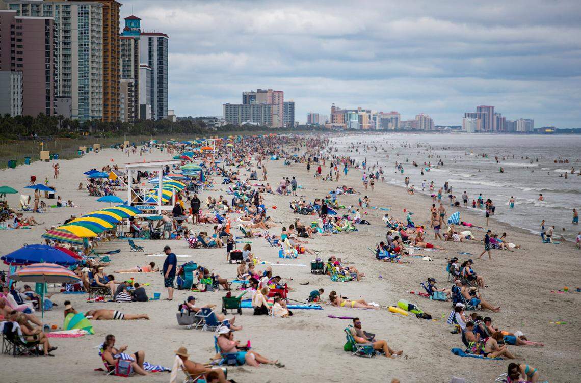 A northbound view of the beach Wednesday afternoon as crowds gather along the coast in Myrtle Beach amidst the coronavirus pandemic.