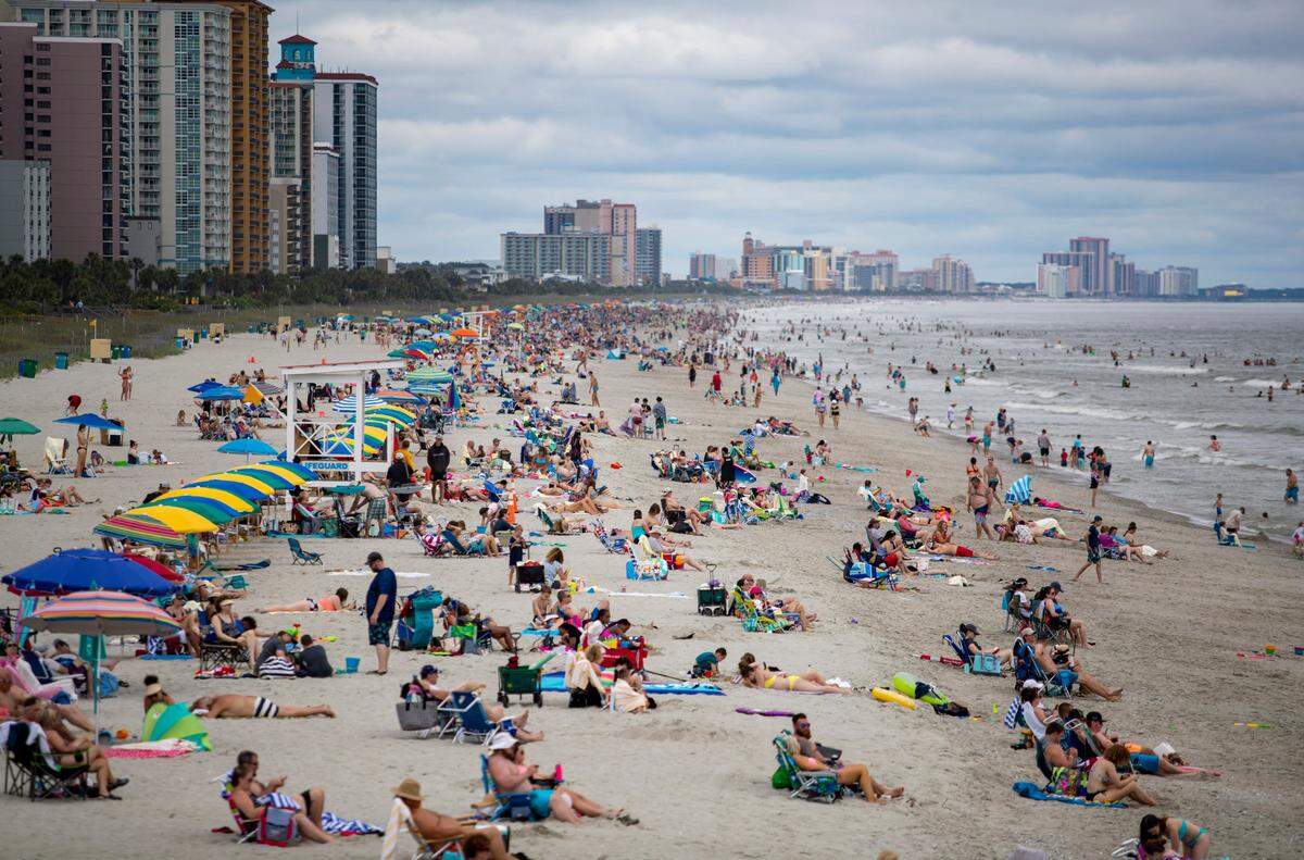 A northbound view of the beach Wednesday afternoon as crowds gather along the coast in Myrtle Beach amidst the coronavirus pandemic.