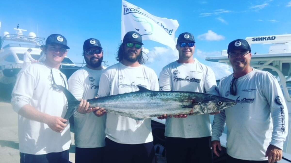 The crew of Molar Man show off a 37.6-pound king mackerel which earned them third place in the SKA-sanctioned Lowcountry Open Saturday out of City Marina in Charleston.