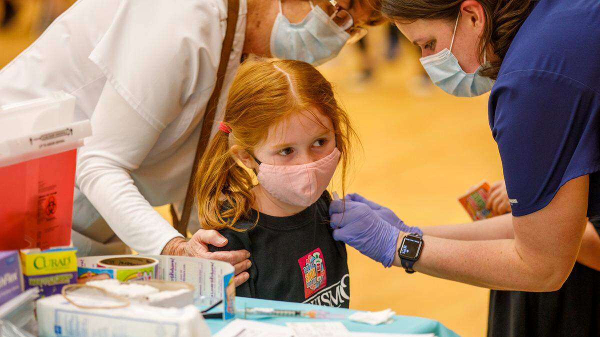 A child gets a COVID-19 vaccine at Burgess Elementary School, one of the four clinics for students age 5+, staff and community members hosted by Horry County Schools and Conway Medical Center. Aug. 11, 2021.