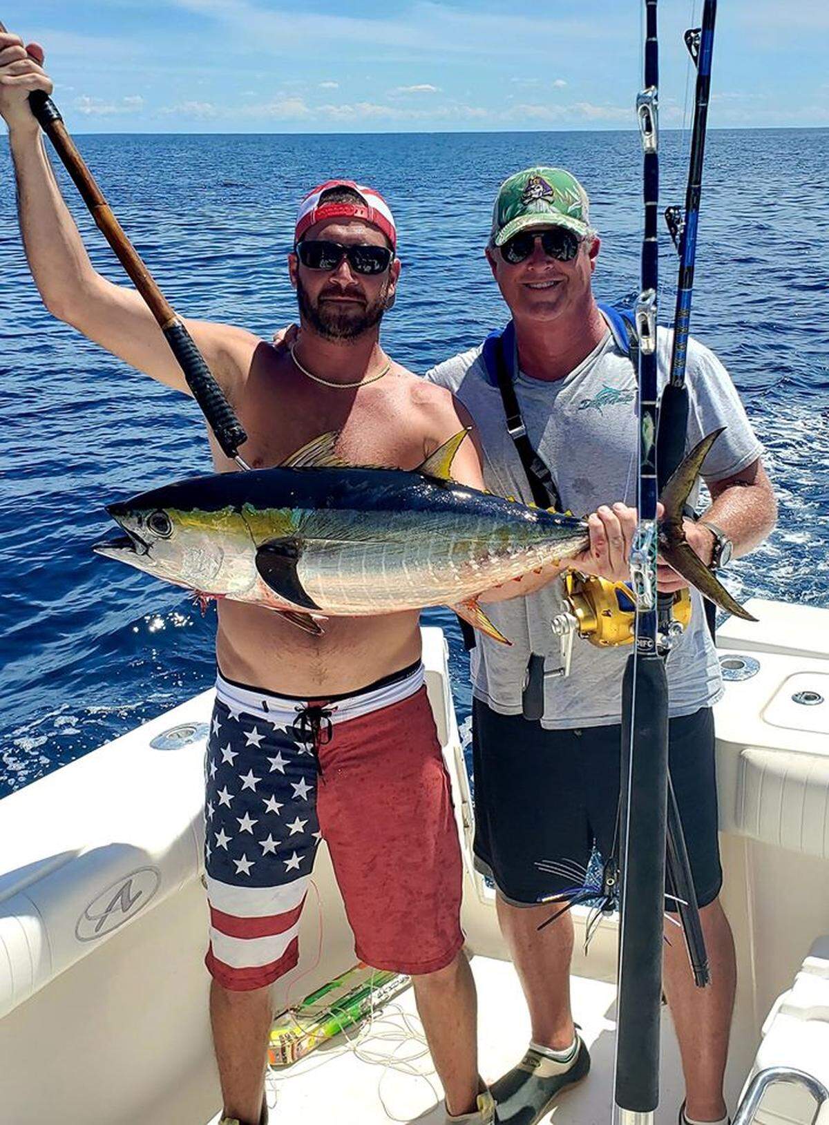 Chance Martini and Bobby Ray Hall Jr. show off a yellowfin tuna caught Tuesday near the Georgetown Hole.