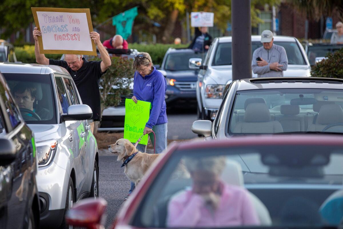 A prayer vigil for all the health care workers at Tidelands Waccamaw Community hospital was held in the parking lot by hundreds of members of Belin Memorial UMC and members of the Murrells Inlet community holding signs, praying and singing in support of the hospital staff on Thursday evening. April 2, 2020. April 2, 2020