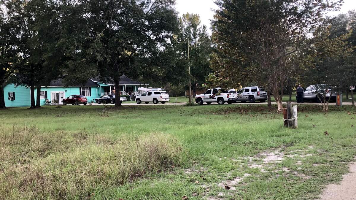 Authorities respond to a report of swimmers in distress in a pond off Lilac Road in Horry County.