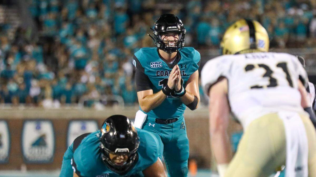Coastal’s Grayson McCall prepares to take a snap against Army. Coastal Carolina University beat Army in the first game of the 2022 season at Brooks Stadium 38-28. A record crowd of 21,165 attended the game. Sept. 3, 2022.