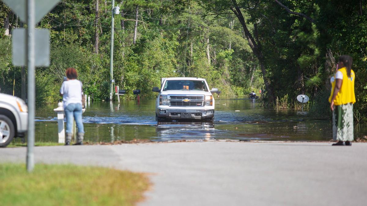 Wampee residents drive along Collins Road Sunday trying to get to and from their homes in the area.