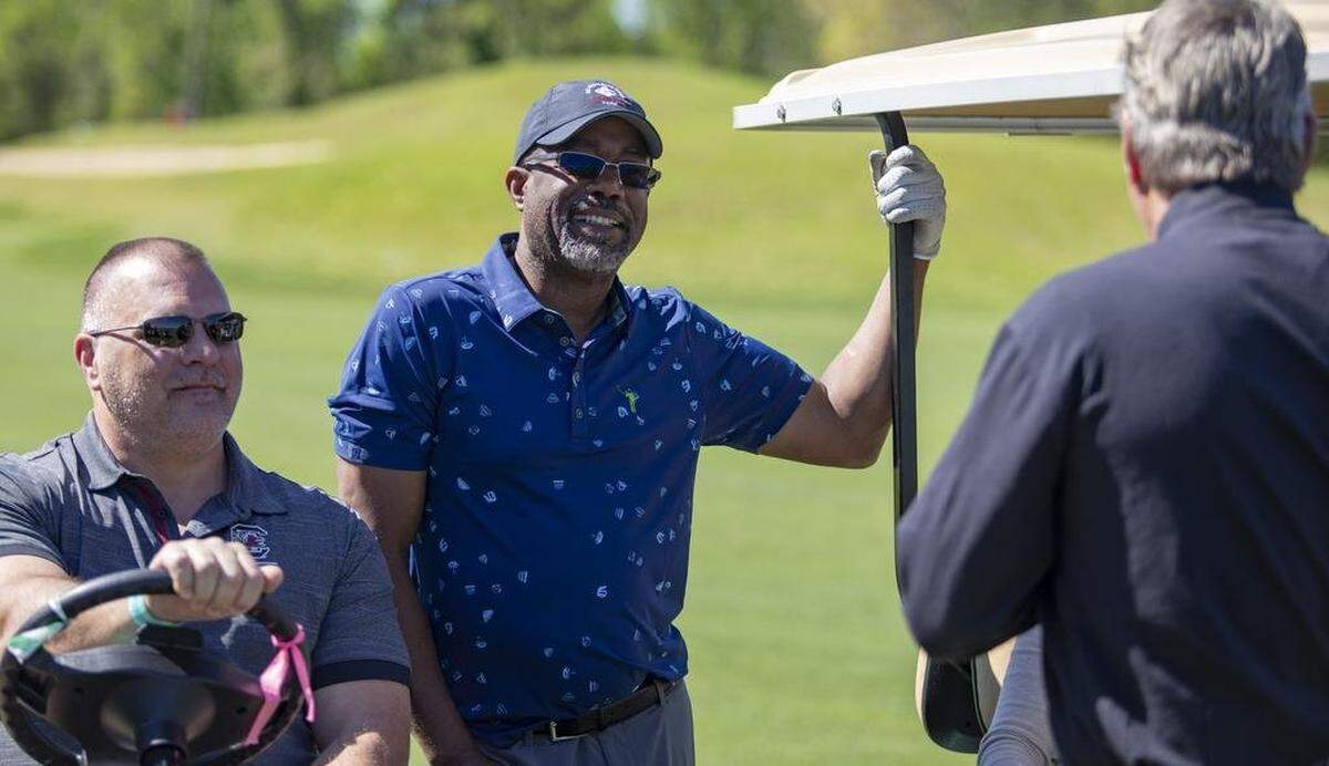 Hootie & the Blowfish lead singer Darius Rucker speaks with friends during a break at Barefoot Resort’s Dye Club on April 15, 2019 during the annual Hootie & the Blowfish Monday After the Masters tournament.