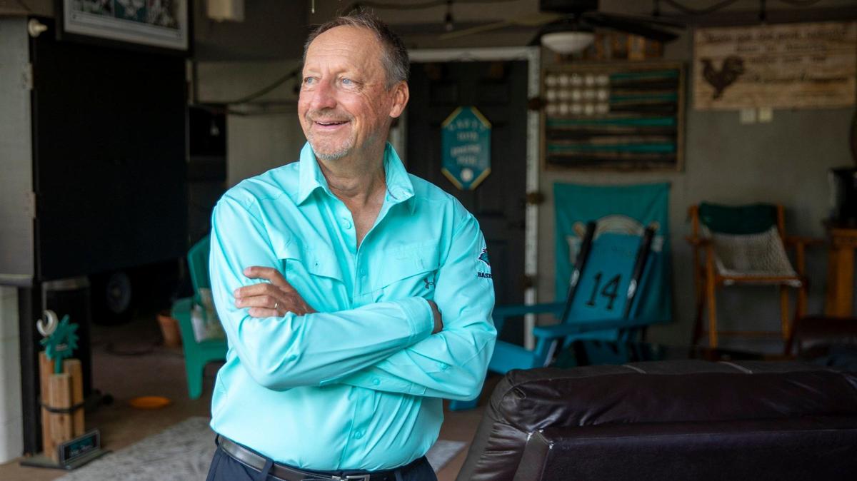 Coastal Carolina Coach Gary Gilmore looks out from his CCU themed “man cave” at his North Litchfield Beach home named ‘Poppa’s House’. Gilmore is retiring after 39-years of coaching. May 6, 2024.
