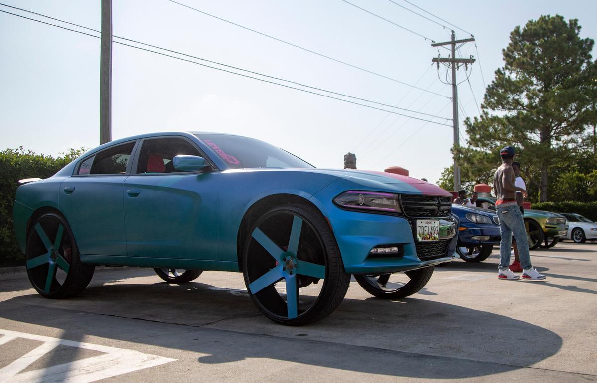 A customized Dodge Charger sits on display at the EZ Street Car Wash Saturday afternoon in Myrtle Beach.